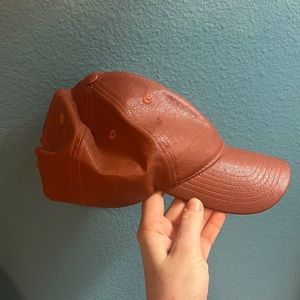 orange/brown leather hat